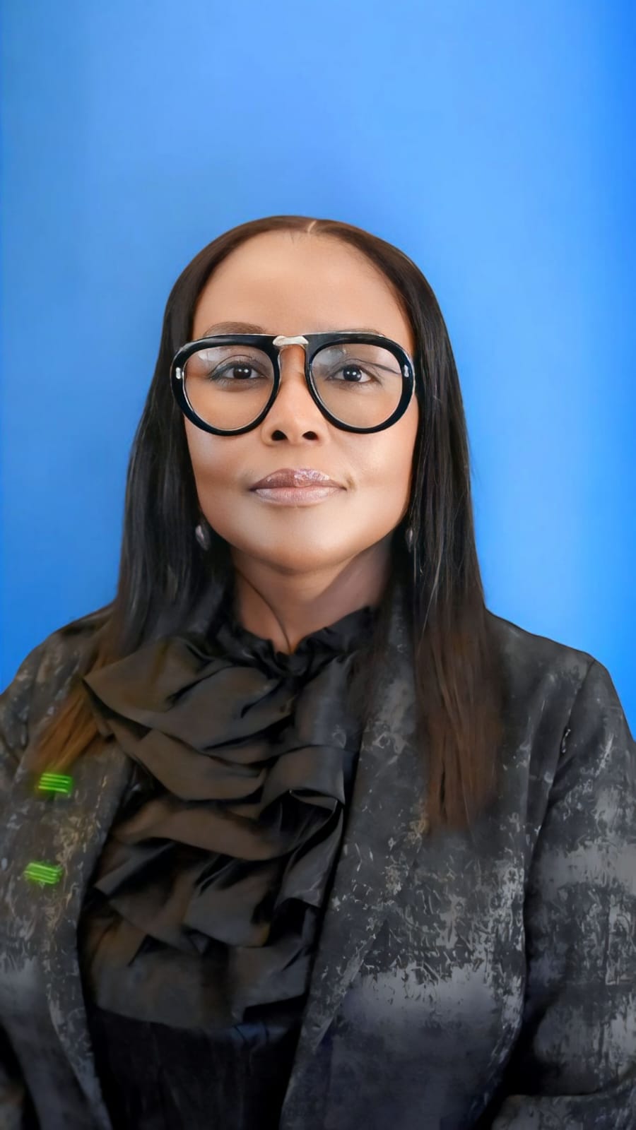 Executive corporate headshot Johannesburg — professional woman blue backdrop